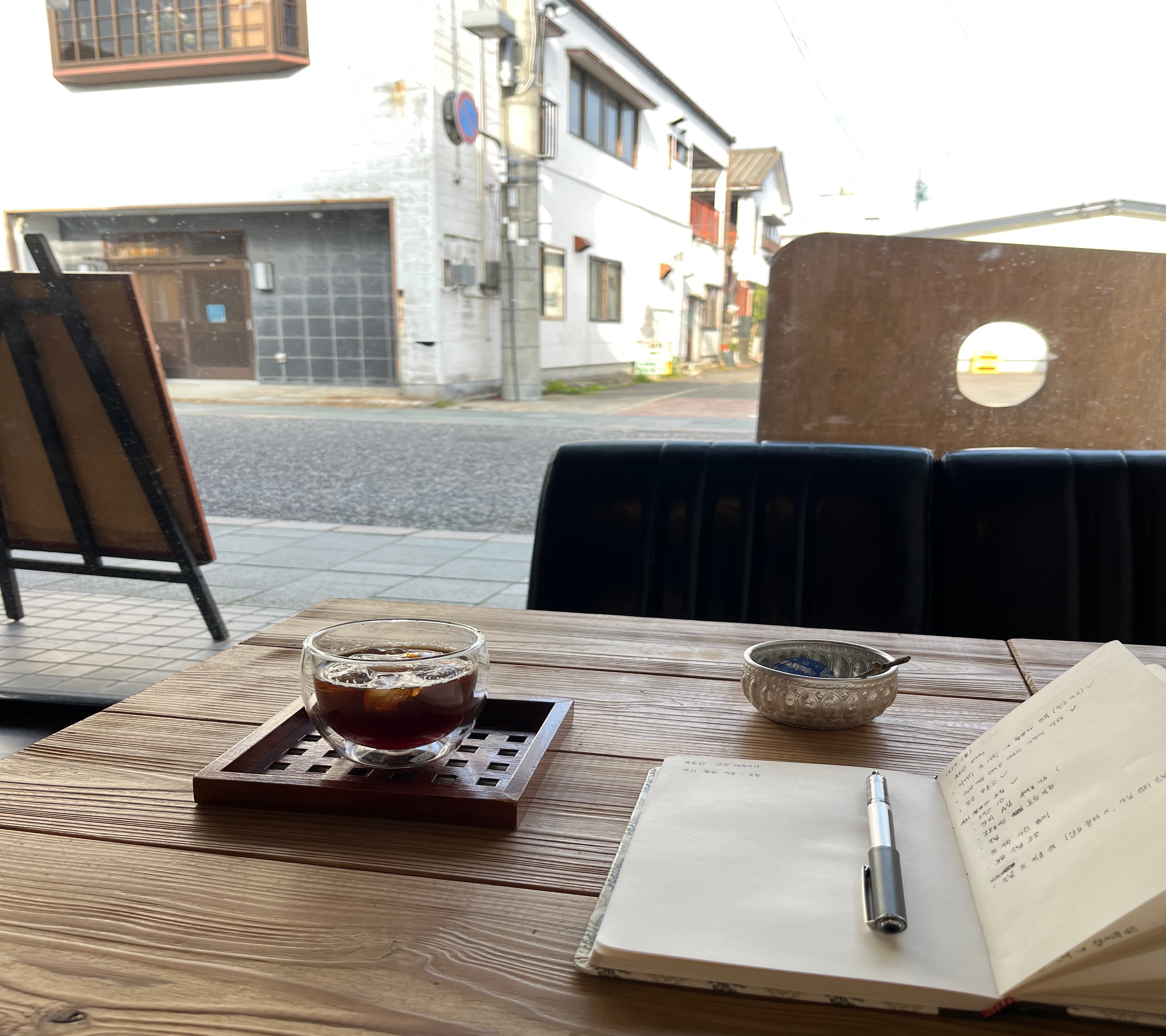 Sun Lee writing a Korean saju reading at her desk in Seoul